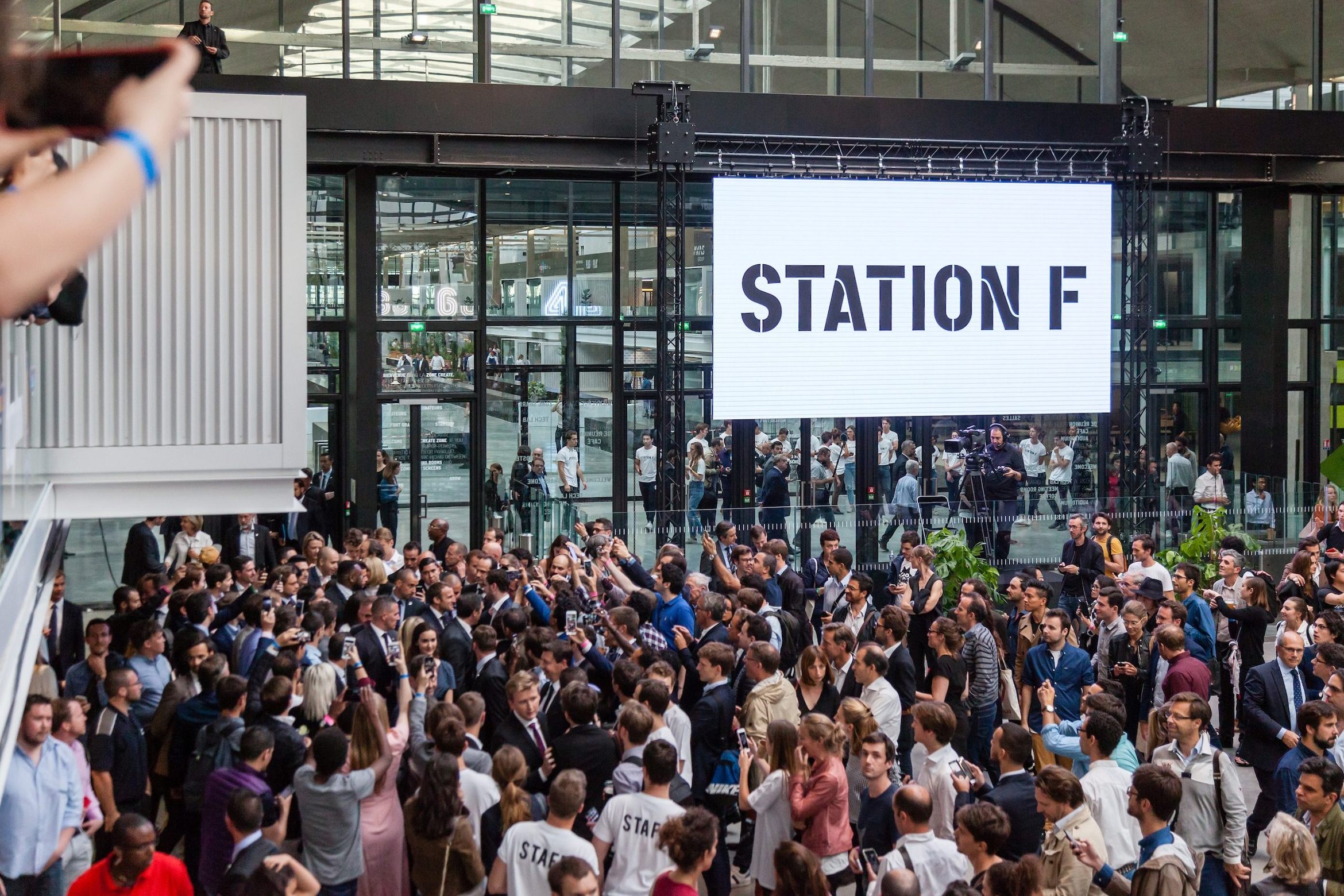 The logo of the startup house during its inauguration at station F
